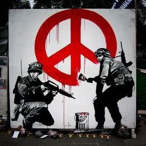 Soldiers painting peace symbol Banksy Grafitti